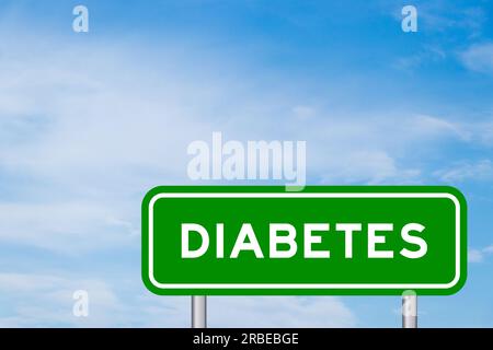 Green color transportation sign with word diabetes on blue sky with white cloud background Stock Photo