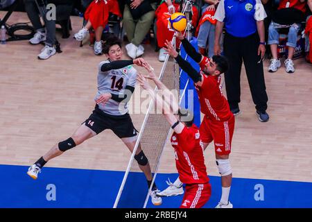Pasay City, Philippines. 9th July, 2023. Ishikawa Yuki (L) of Japan spikes the ball during the Pool 6 match between Japan and Poland at the Men's Volleyball Nations League in Pasay City, the Philippines, July 9, 2023. Credit: Rouelle Umali/Xinhua/Alamy Live News Stock Photo