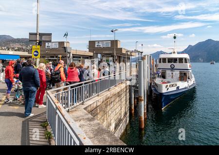 Intra-Verbania, Piedmont, Italy - April 9, 2023: People are waiting for ferry at the port in Intra, on the lake Maggiore. Stock Photo