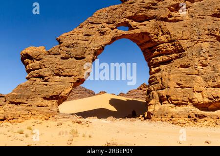 Tikoubaouine Arch - amazing rock formation at Tikoubaouine.   Tassili n'Ajjer National Park, Algeria Stock Photo