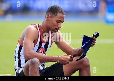 Zharnel Hughes looks at his gold medal after winning the men’s 200m final during the UK Athletics Championships at Manchester Regional Arena, Manchester, United Kingdom, 9th July 2023  (Photo by Conor Molloy/News Images) in Manchester, United Kingdom on 7/9/2023. (Photo by Conor Molloy/News Images/Sipa USA) Stock Photo