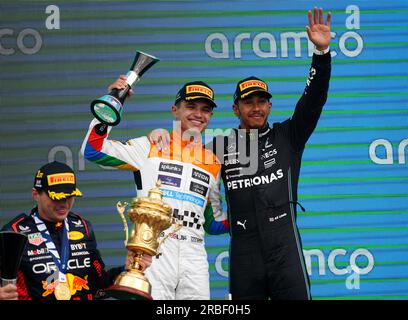 McLaren's Lando Norris (left) and Mercedes' Lewis Hamilton celebrate