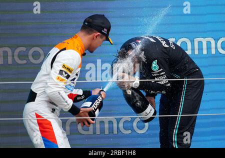 McLaren's Lando Norris (left) and Mercedes' Lewis Hamilton celebrate