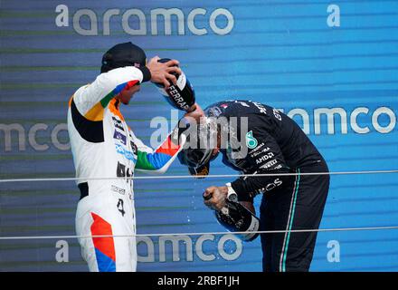 McLaren's Lando Norris (left) and Mercedes' Lewis Hamilton celebrate