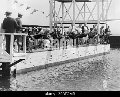 Massapequa, New York:  July 28, 1927 The start of the women's 100 meter freestyle at the National A.A.U. Swimming Championship meet being held at the Biltmore Shore Yacht Club on Long Island. The event was won by Martha Norelius, and in second place was Adelaide Lambert. Stock Photo