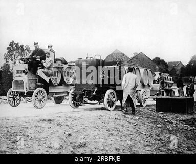 France:  February, 1915 Motor-driven trucks which follow in the wake of the French army carrying tanks of pure drinking water. Stock Photo