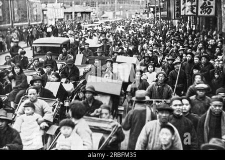 Shanghai, China:  February 22, 1932 Refugees fleeeing from the Chapei district in Shanghai to the Shanghai International Settlement after a Japanese airplane bombing. Stock Photo