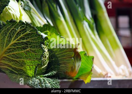Market stall with backlit cabbages and beetroot Stock Photo