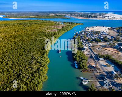Aerial view of a boat in the river with mangroves in the Morondava river, Toliara province, Madagascar, Africa Stock Photo