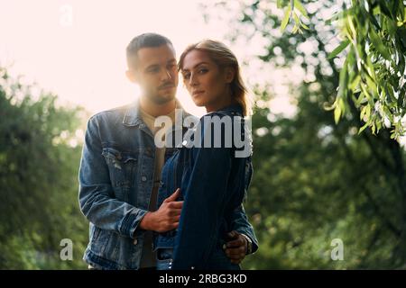 Young beautiful loving couple posing on nature. Love, dating, relationship concept Stock Photo