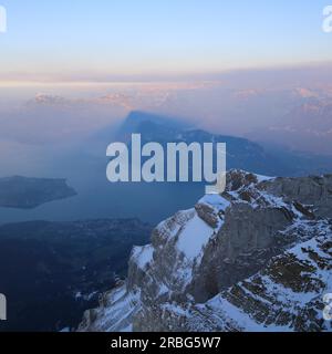 View from Mount Pilatus towards Horw. Buergenstock throwing a shadow at Mount Rigi Stock Photo