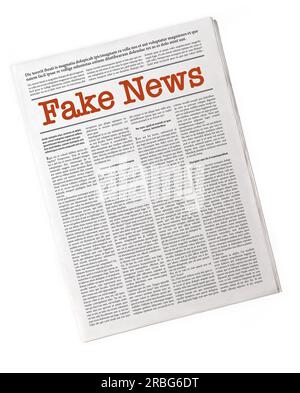 Fake newspaper reporting fake news. Fake Lorem ipsum text, isolated on white Stock Photo
