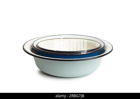 Pile of old enamel dishes, or bowls, isolated on white background Stock Photo