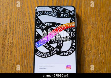 Threads, an Instagram app by Meta, startup / loading screen showing the word threads repeated on a Samsung Galaxy smartphone screen. UK Stock Photo