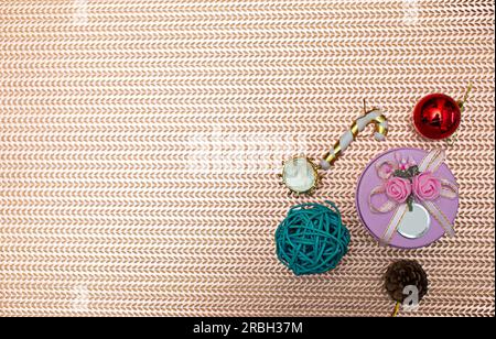 Christmas cluster high view gift boxes on golden background Gifts are scattered along the edge of the frame. Leave a blank space in the middle for you Stock Photo