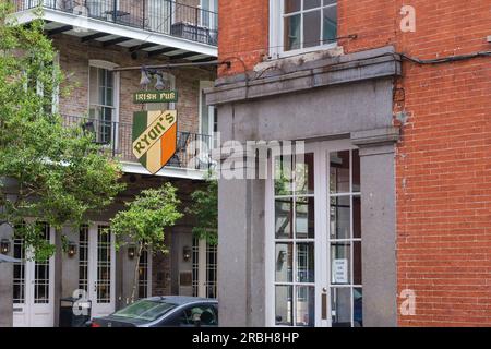 NEW ORLEANS, LA, USA - JULY 9, 2023: Side view of building and sign for Ryan's Irish Pub in the French Quarter Stock Photo