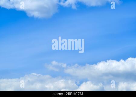 The sunlight shining through the fluffy clouds made the outdoor scene look like a slice of heaven on earth. Stock Photo