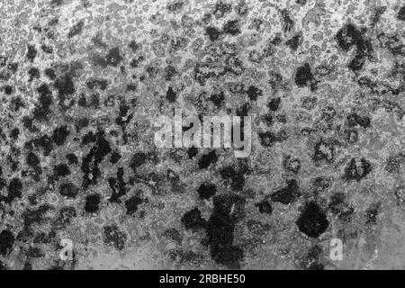 Black and white photo of rust stains on the zinc. Looks like a beautiful art. Stock Photo