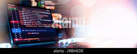Notebook closeup photo. CSS, JavaScript and HTML usage. Monitor closeup of function source code. Abstract IT technology background. Stock Photo