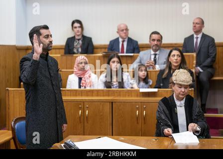 File photo dated 29/03/23 of Humza Yousaf taking the oath as he is sworn in as First Minister of Scotland at the Court of Session, Edinburgh. Half of respondents to a new poll have said they believe the First Minister is doing a bad job. A YouGov study, shared exclusively with the PA news agency of 1,100 Scots between June 26 and 29, shows 50% viewed the First Minister as having done a bad job since taking office. Issue date: Monday July 10, 2023. Stock Photo