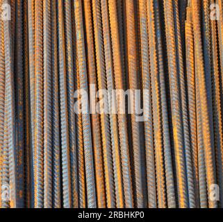 Rebar (short for reinforcing bar) textured background. Reinforcing steel, reinforcement steel, is a steel bar used as a tension device in reinforced c Stock Photo