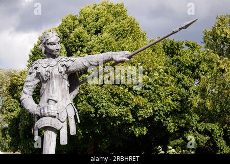 The six metre tall statue of Aethelflaed, the Anglo-Saxon warrior Queen by artist luke Perry situated on the Island outside the railway station in Tamworth, Staffs. Aethelflaed is a key figure from Tamworth’s past, having played a pivotal role in English history by building a chain of fortifications against Viking invaders throughout the Kingdom of Mercia. Her fortification of Tamworth in 913 AD became the forerunner to Tamworth Castle. Daughter of King Alfred the Great, Aethelflaed’s accession as a female ruler has been described as one of the most unique events in early medieval history. Stock Photo