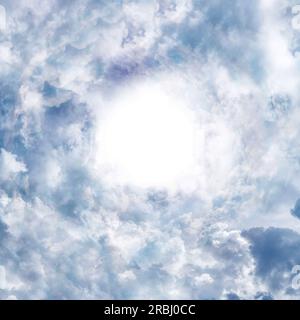 clouds forming a tunnel in the sky with a bright center Stock Photo