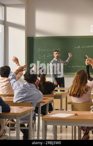 Math teacher giving lessons. Classroom with students. School education ...
