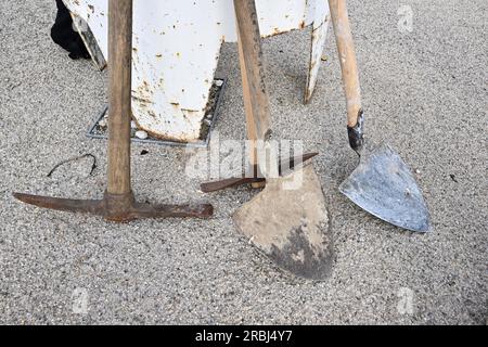 Munich, Germany. 10th July, 2023. Hoe and shovel stand at the start of construction for the Oktoberfest on the Theresienwiese. Two and a half months before the Oktoberfest, construction of the beer tents begins on the festival grounds, followed later by the rides. Credit: Felix Hörhager/dpa/Ģ����ý Live News Stock Photo