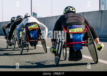 close-up group para athlete in wheelchair racing marathon race, sports summer games para athletics Stock Photo
