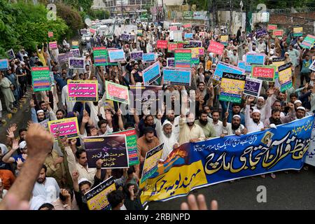 Muslim protestors chant slogans during a rally to denounce burning of ...
