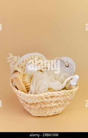 Bottle of shower gel and wicker basket with shells on sink in bathroom  Stock Photo - Alamy