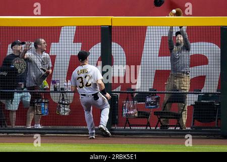 Pittsburgh Pirates center fielder Jack Suwinski looks out of the dugout  before the start of a baseball game against the Miami Marlins, Friday, June  23, 2023, in Miami. (AP Photo/Wilfredo Lee Stock