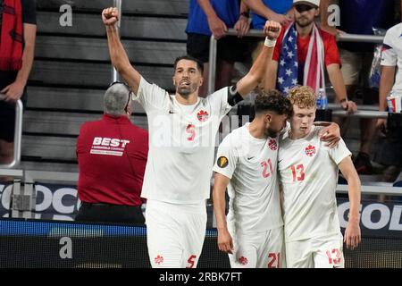 Canada forward Jacob Shaffelburg (13) moves the ball against United States  defender Bryan Reynolds (5) in extra time during a CONCACAF Gold Cup  semi-final soccer match, Sunday, July 9, 2023, in Cincinnati. (