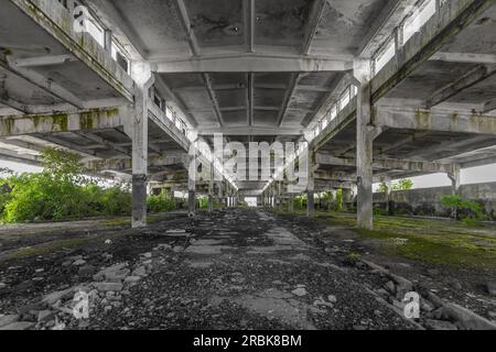 Ruins of an industrial factory. Abandoned building interior. Stock Photo