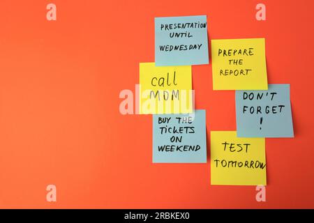 Many different reminder notes on orange background, flat lay. Space for text Stock Photo