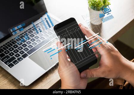 analyzing on a laptop Showing business analytics dashboard technology management strategy datum concept process report chart success investment statis Stock Photo