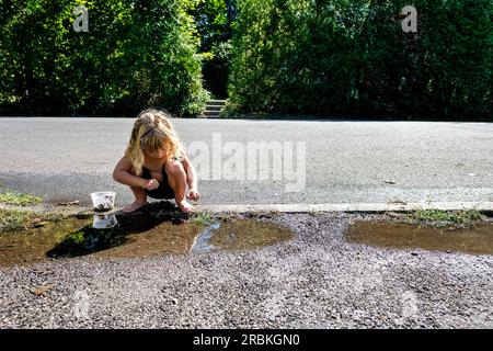 little girl peeing outdoors Shutterstock