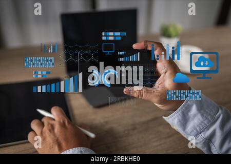 analyzing on a laptop Showing business analytics dashboard technology management strategy datum concept process report chart success investment statis Stock Photo