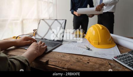 Construction concept of meeting engineers team or architects for projects working with partners and engineering tools on modeling and blueprint design Stock Photo