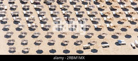 Top view of beach with white umbrellas. Golden sands, Kavarna, Bulgaria. Banner Stock Photo