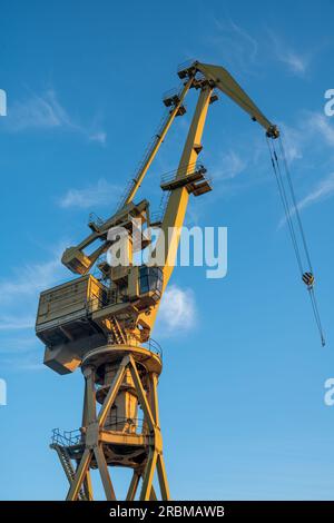 Shipyard crane against the blue sky Stock Photo - Alamy