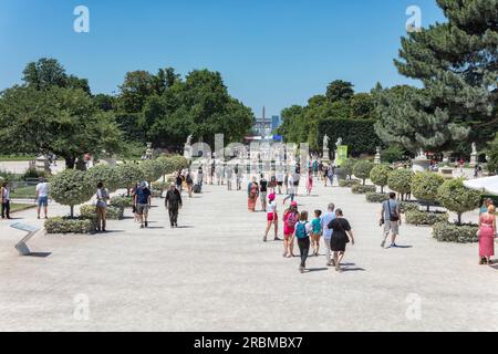 Jardin des Tuileries. People walk in Allee Centrale in the 17th century, Tuileries Gardens on hot sunny day. 1 Arr. Place de la Concorde, Paris Stock Photo