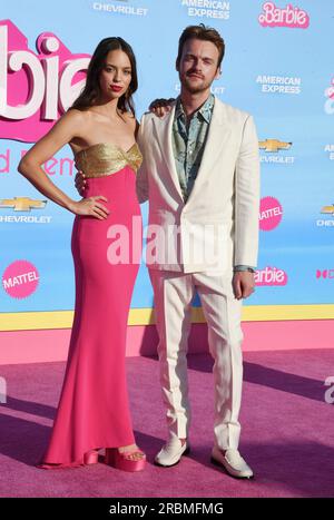 LOS ANGELES, CALIFORNIA - JULY 09: (L-R) Claudia Sulewski and FINNEAS attend the World Premiere of 'Barbie' at the Shrine Auditorium and Expo Hall on Stock Photo