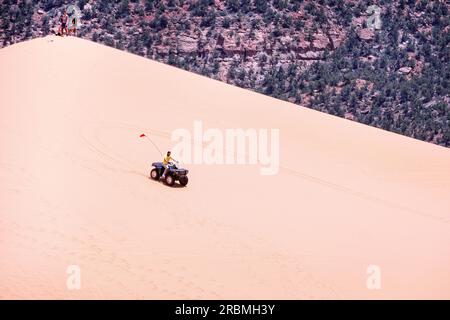 ATV driving on the Coral Pink Sand Dunes Utah USA Stock Photo