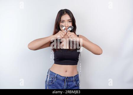 belly of a young woman measuring waist. Measuring tape INCH and CM. Photo  by Willy Matheisl Stock Photo - Alamy