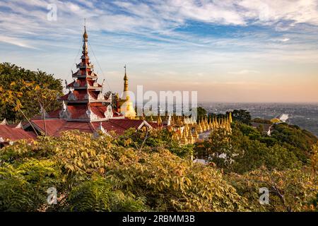 View of the city from the Burmese Su Taung Pyae Pagoda on Mandalay Hill at sunset, Myanmar Stock Photo