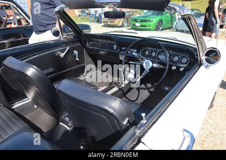 Interior of Classic Ford Mustang Car showing steering wheel and dashboard Stock Photo