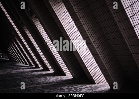 Hong Kong, China - April 28 2023: Triangle corridor of The Hong Kong Cultural Centre is a multipurpose performance facility in Tsim Sha Tsui Stock Photo