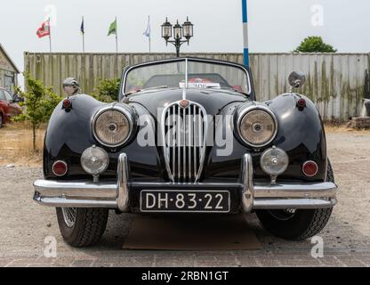 Lelystad, The Netherlands, 18.06.2023, Front view of retro sports car Jaguar XK 140  from 1955 at The National Oldtimer Day Stock Photo